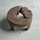 Small low circular four-legged stool in organic old teak with cut-out design H2