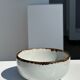 Small white glazed ceramic bowl black edges