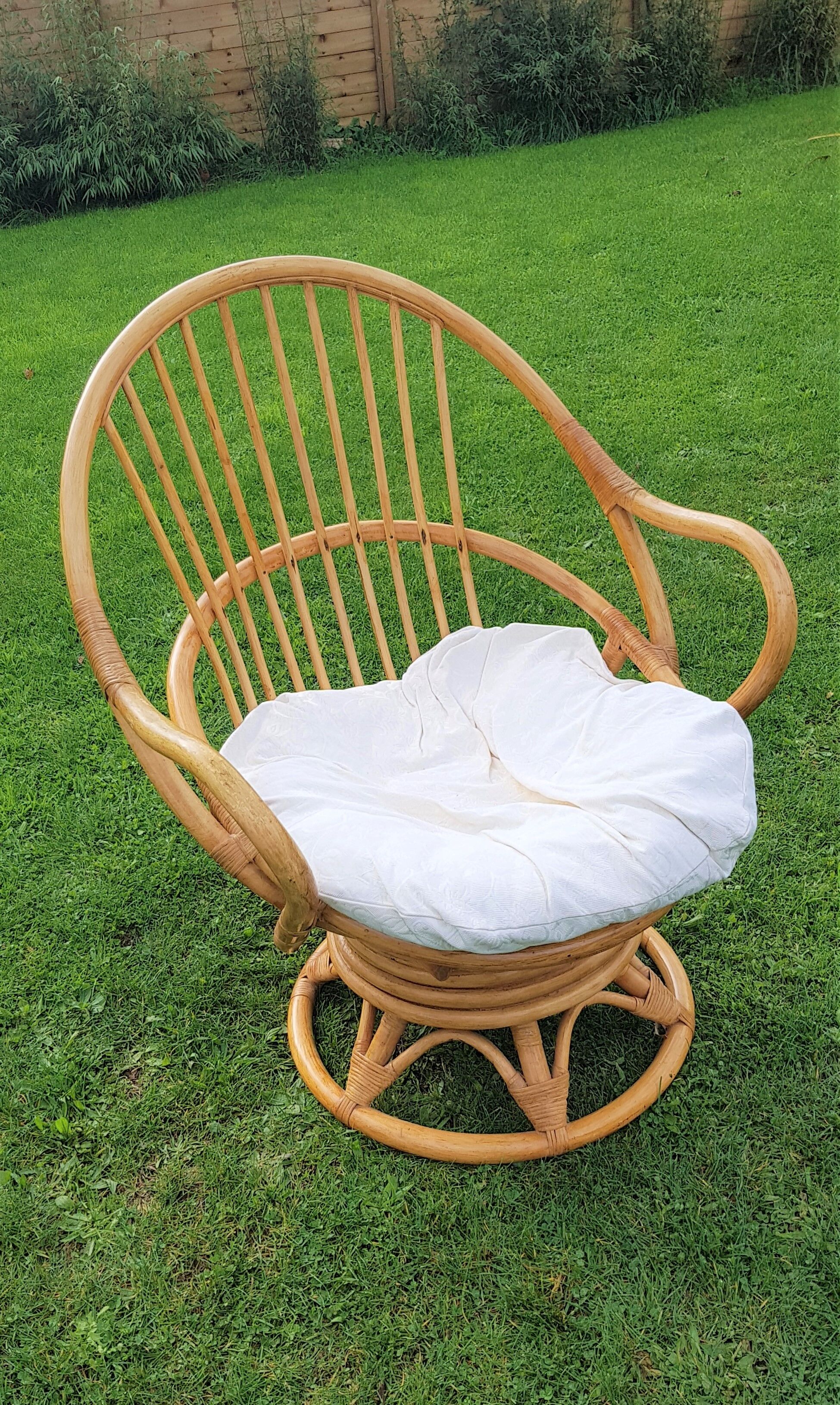Pair of swivel rattan armchairs