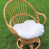 Pair of swivel rattan armchairs