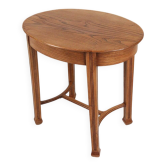 Timeless French Art Deco carved oval side table in oak, 1930s
