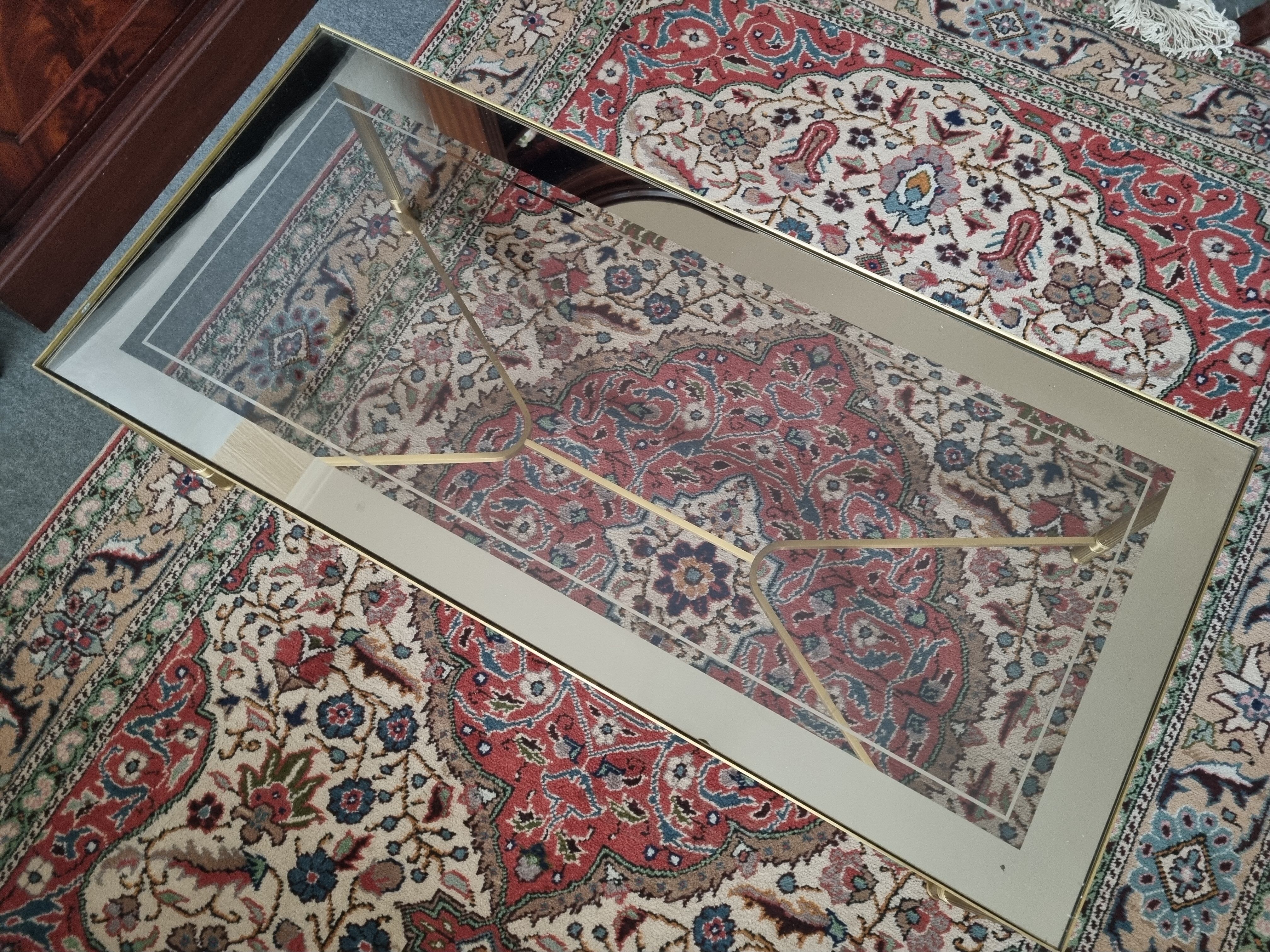 Coffee table in gilded brass and glass top