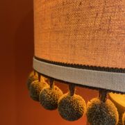 Copper "bouillotte" lamp with Ashoka Silk shade, pom-poms of c