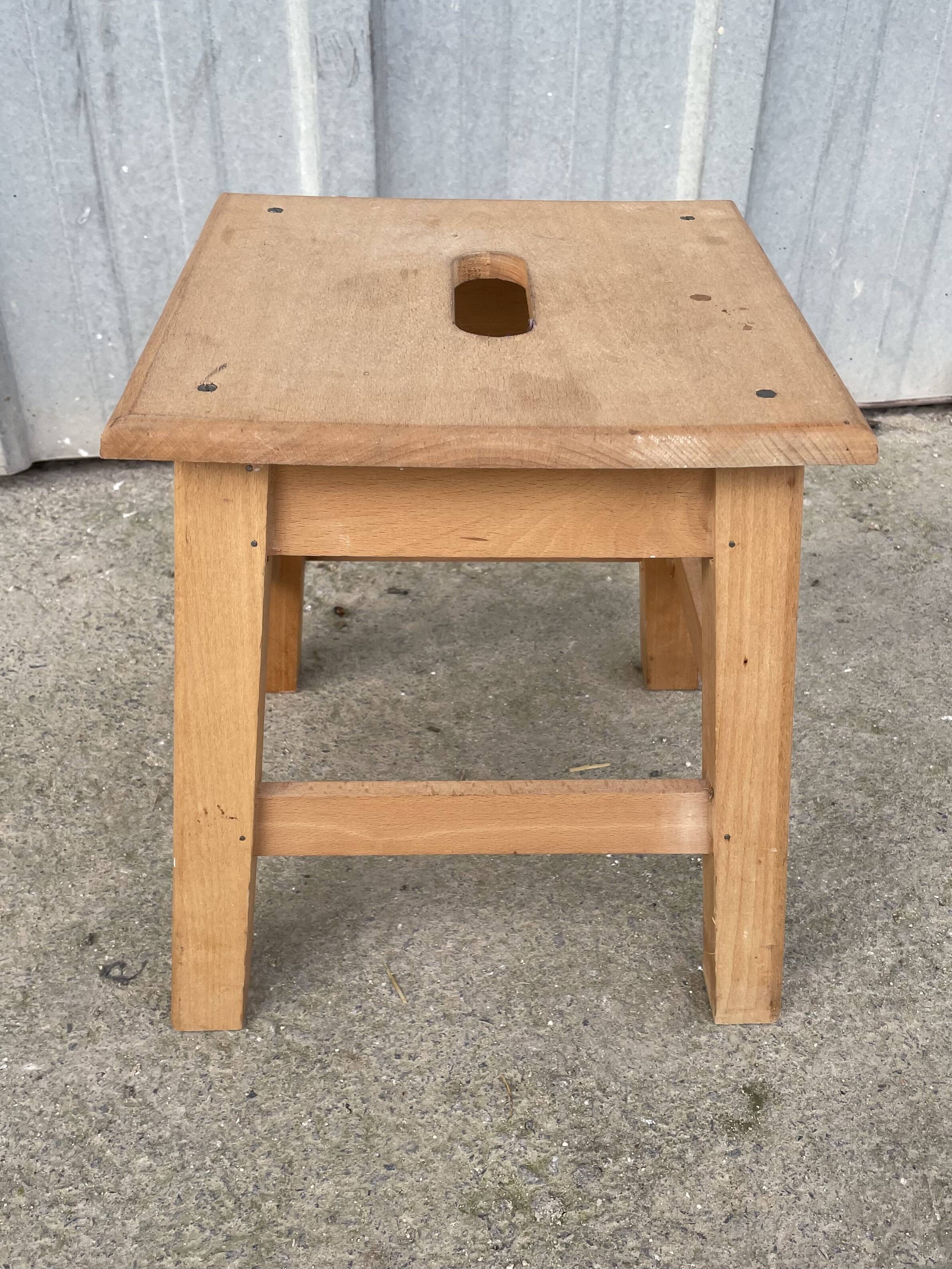 Small low wooden stool