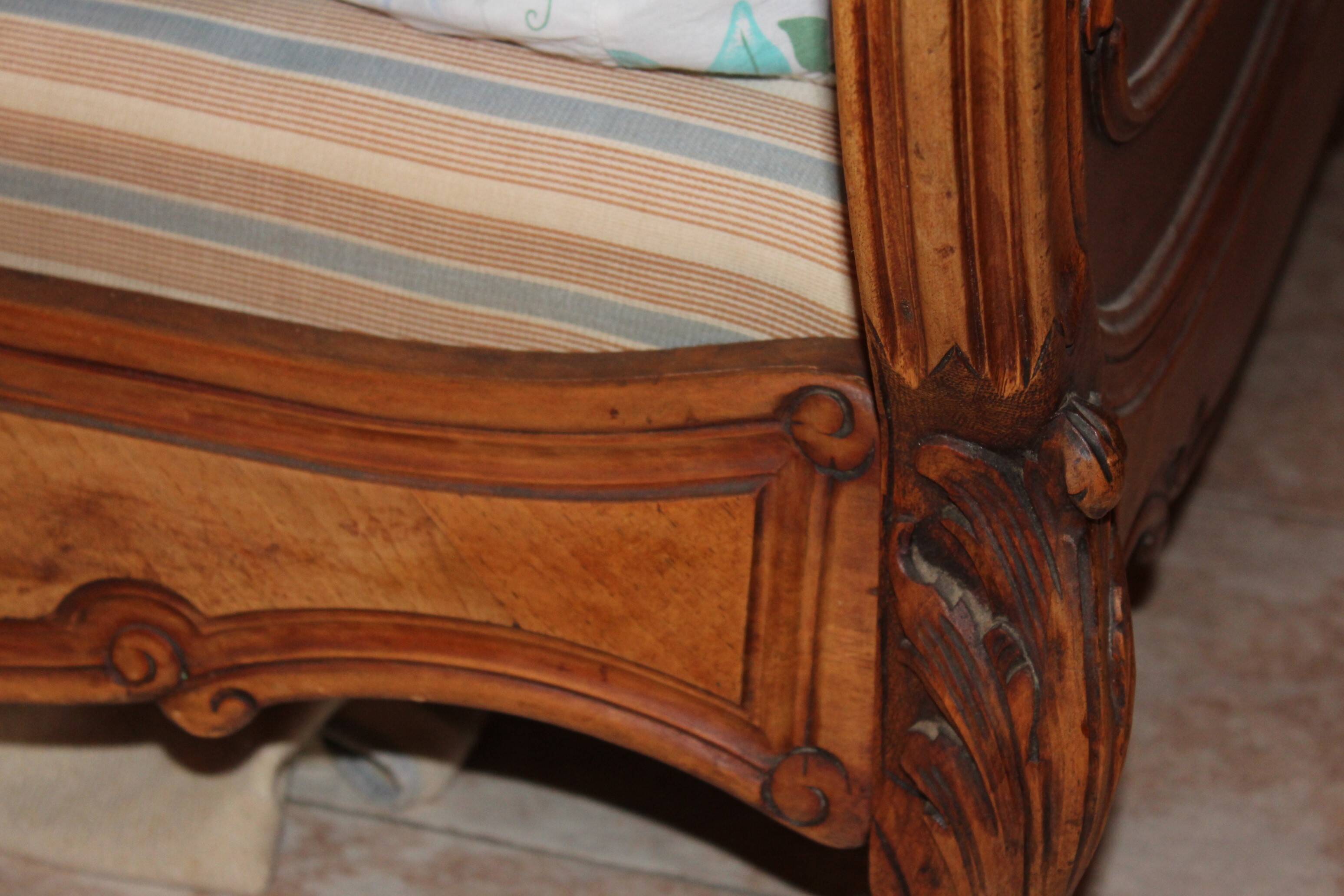 Walnut rocaille bed from the early 20th century.