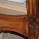Walnut rocaille bed from the early 20th century.