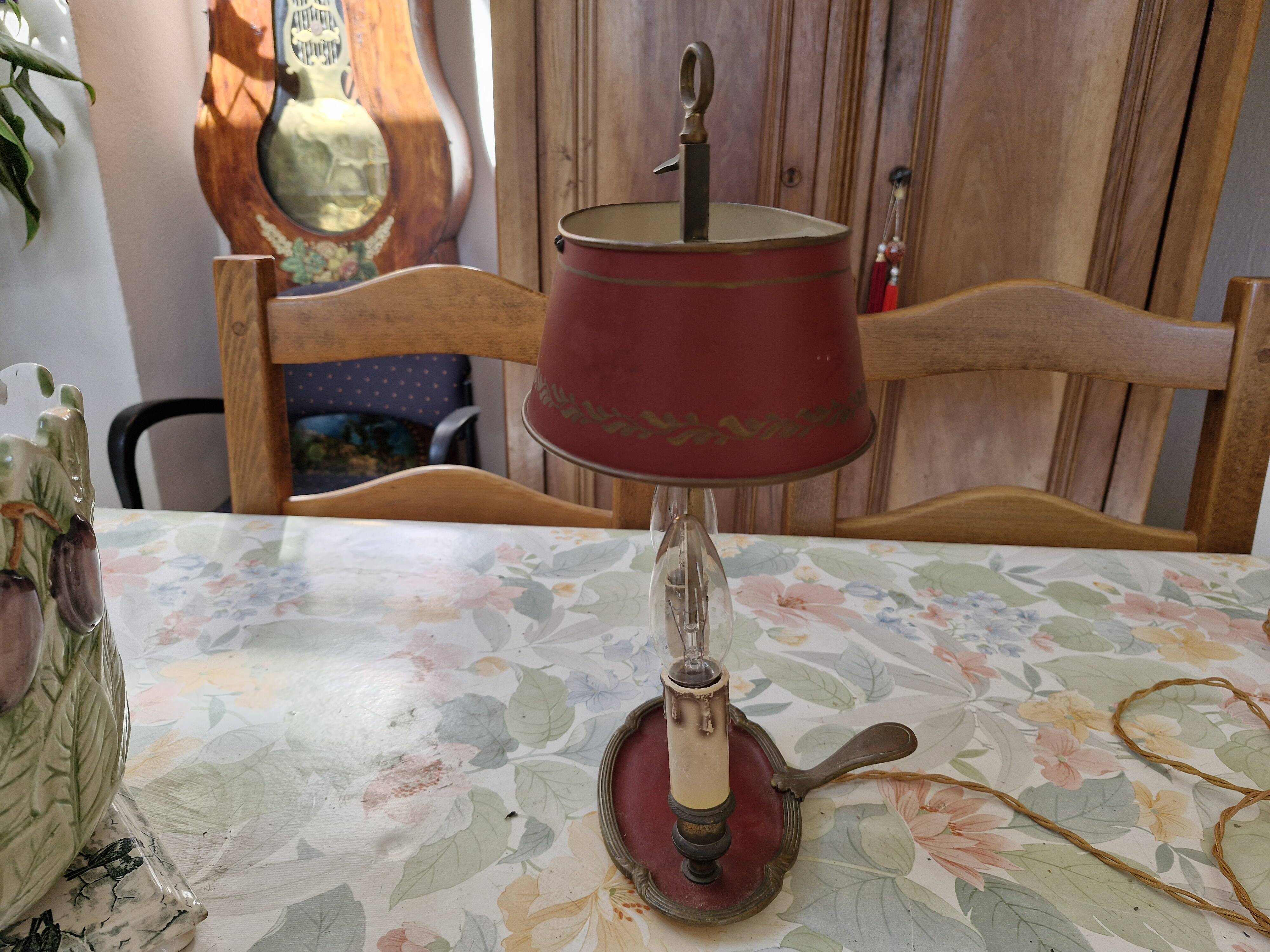 Old silver-plated bronze lamp, except for the arms which are not silver.