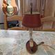 Old silver-plated bronze lamp, except for the arms which are not silver.