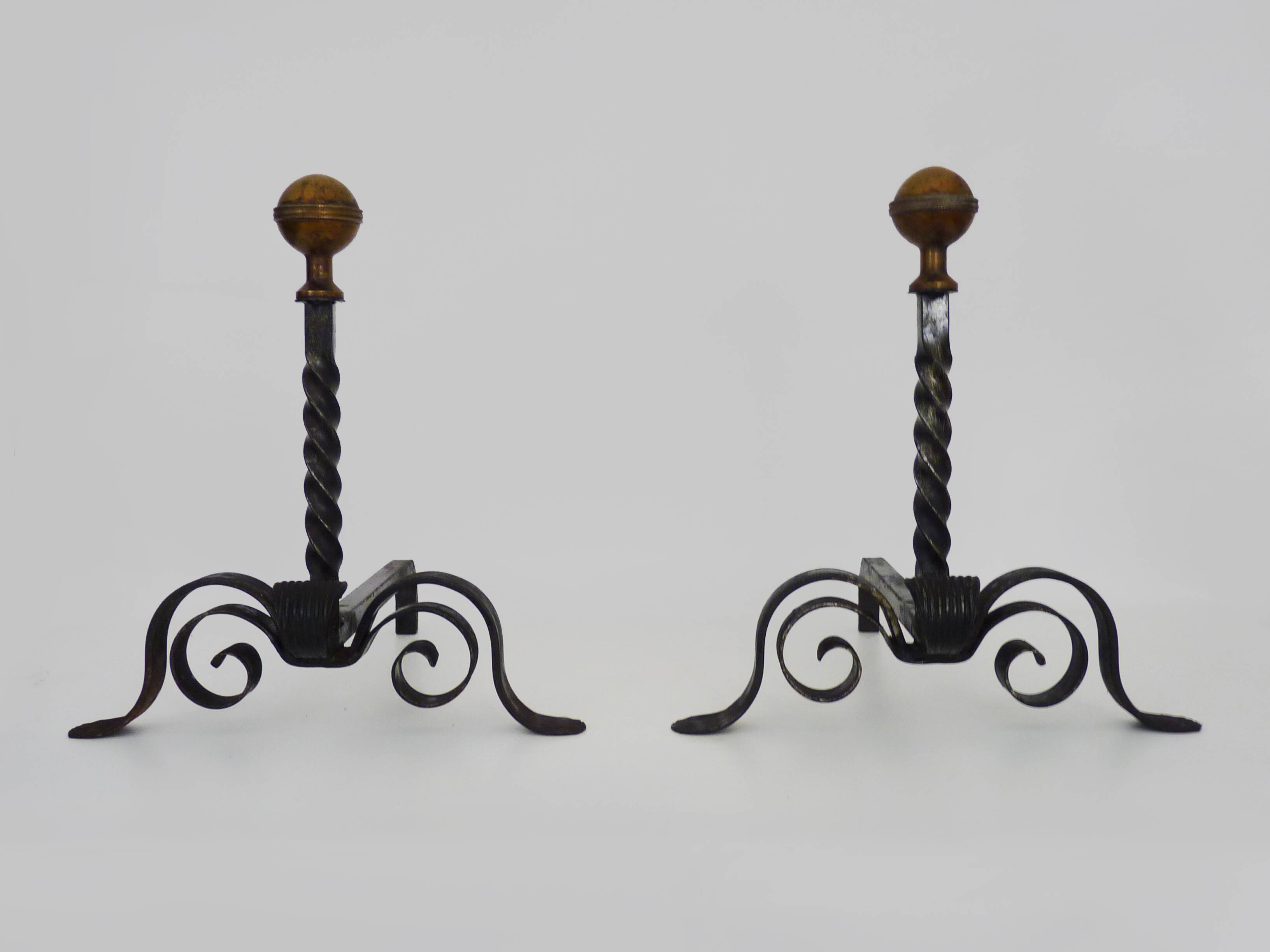 Large pair of wrought iron and brass ball fireplace andirons. 19th century