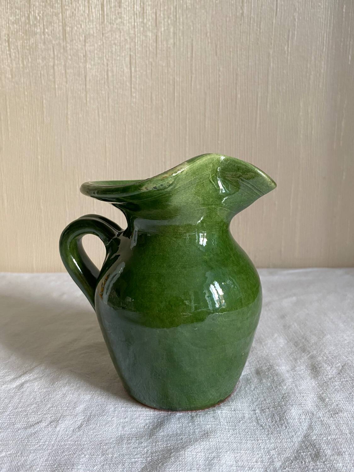 Provençal pitcher in green glazed earthenware