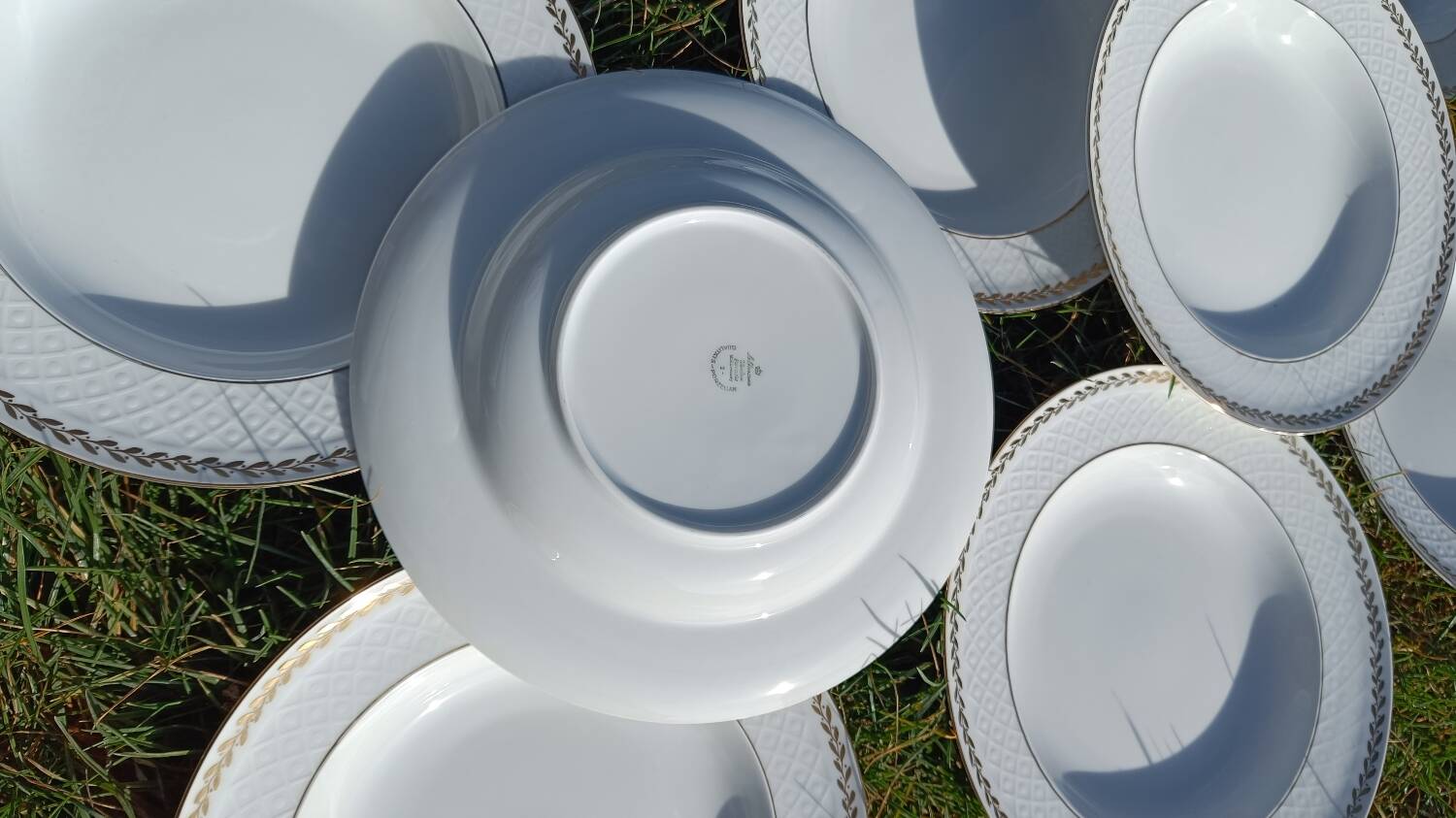 Twelve white porcelain plates