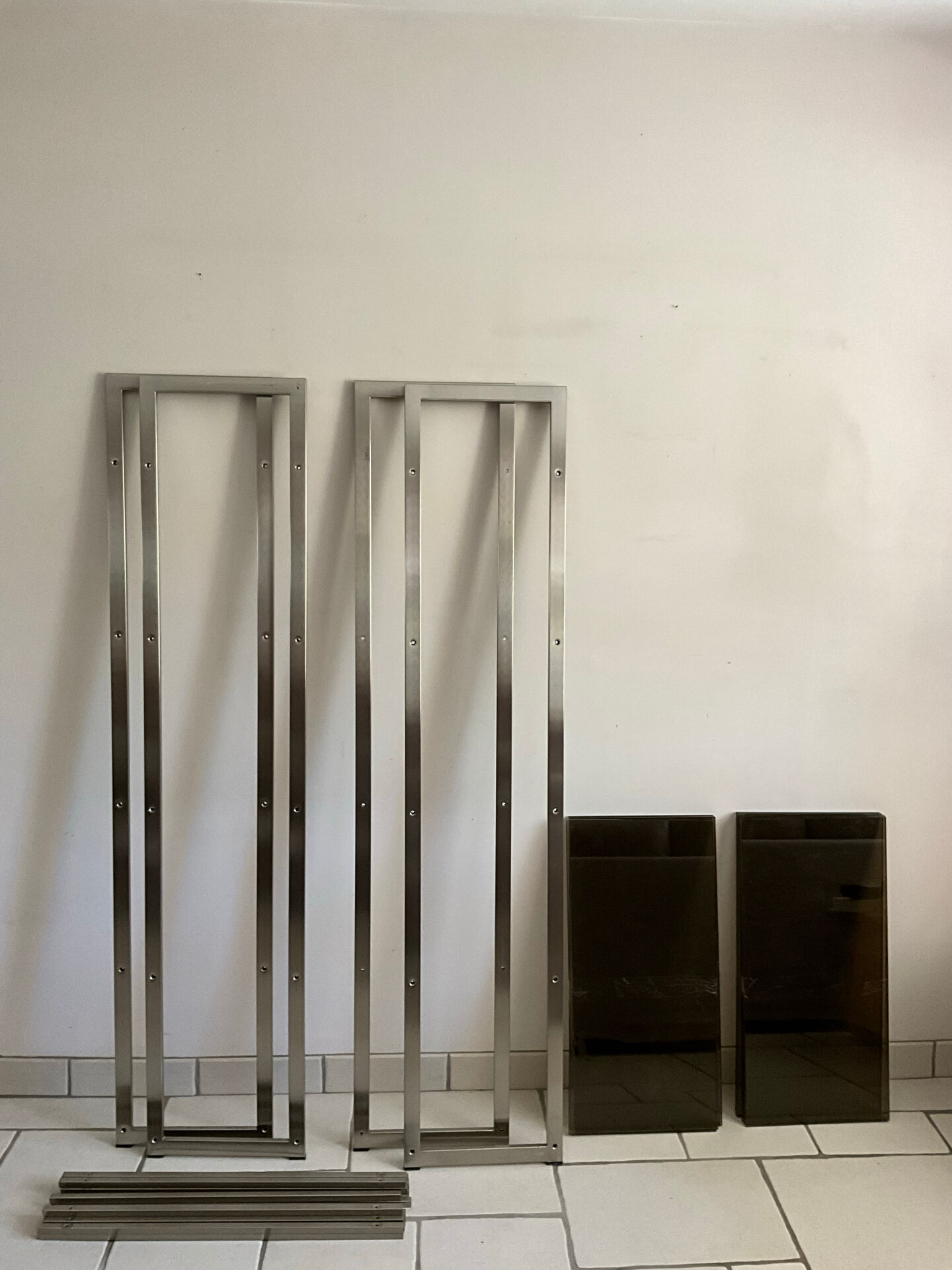 Pair of Artelano bookshelves in anodised metal and smoked glass, 1970s.