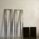 Pair of Artelano bookshelves in anodised metal and smoked glass, 1970s.