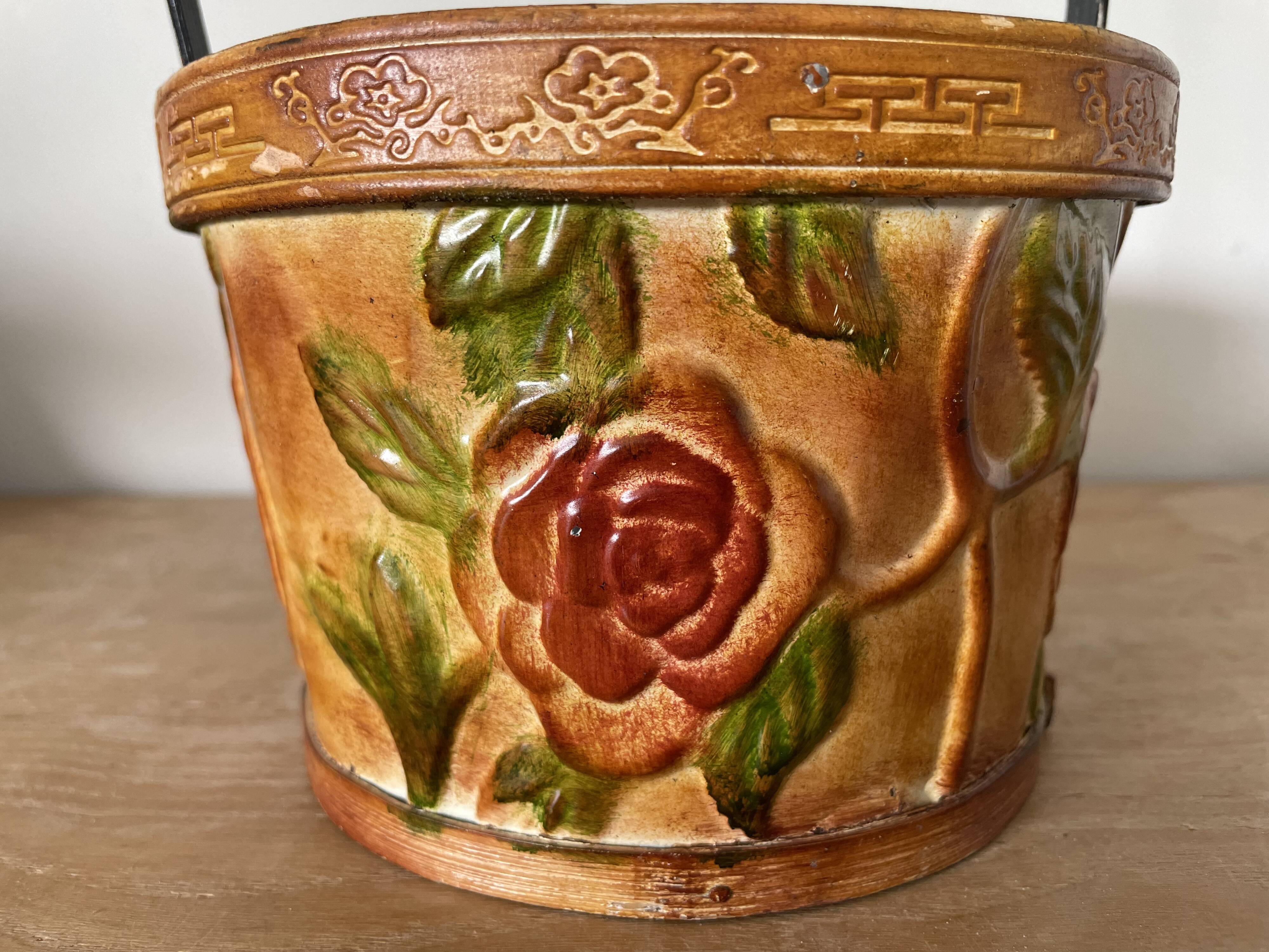 Metal basket with rose patterns