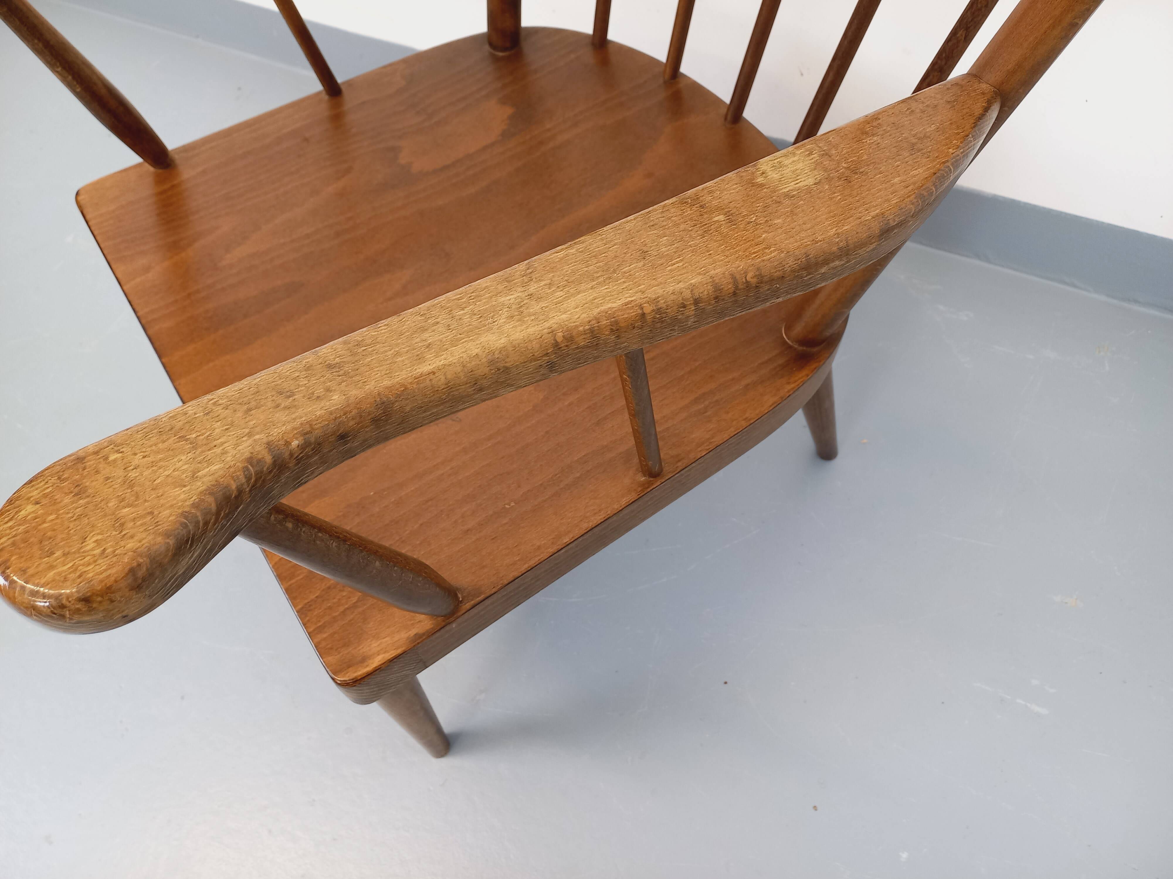 Vintage wooden armchair Baumann model Éventail from the 1960s.