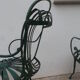 Pair of wrought iron garden chairs by François Carre
