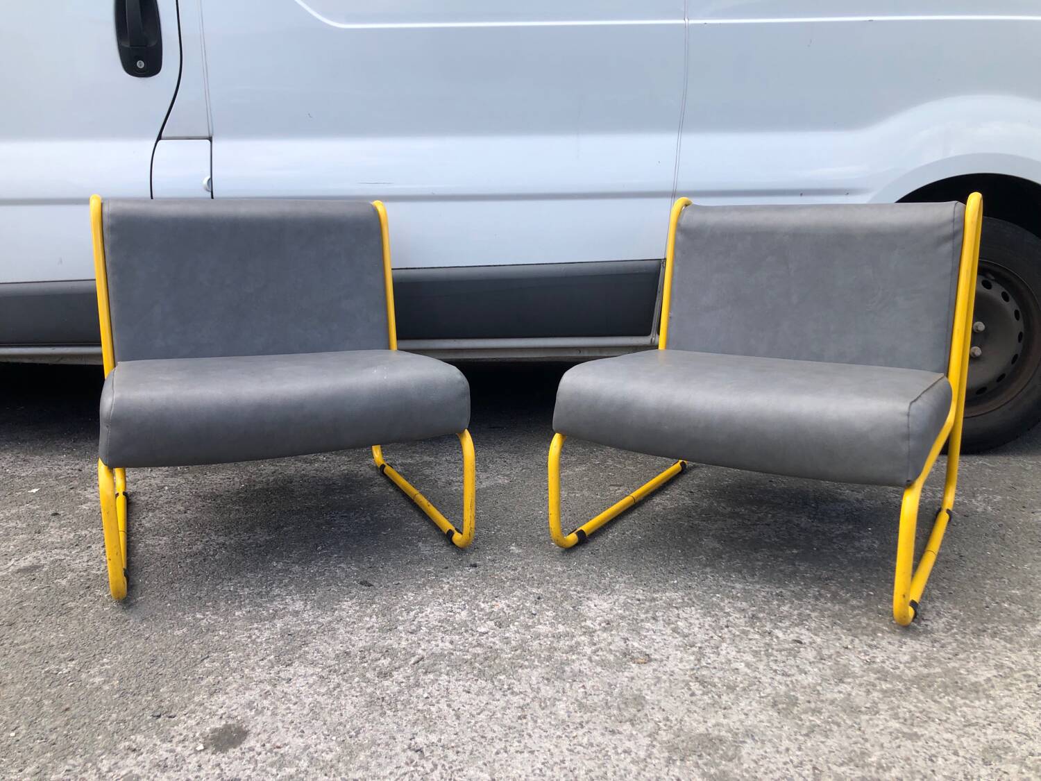 Pair of designer armchairs by Henri Julien