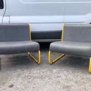 Pair of designer armchairs by Henri Julien