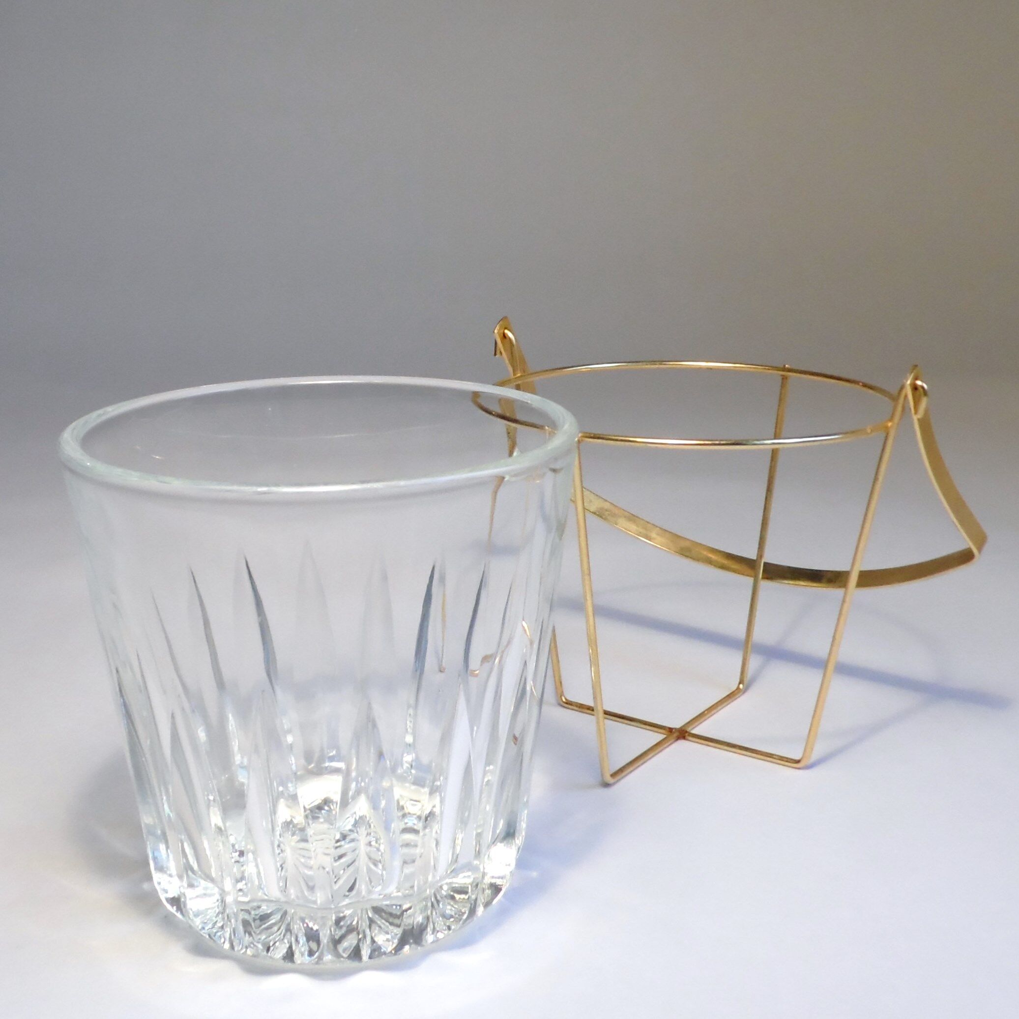 Glass and gold metal ice bucket