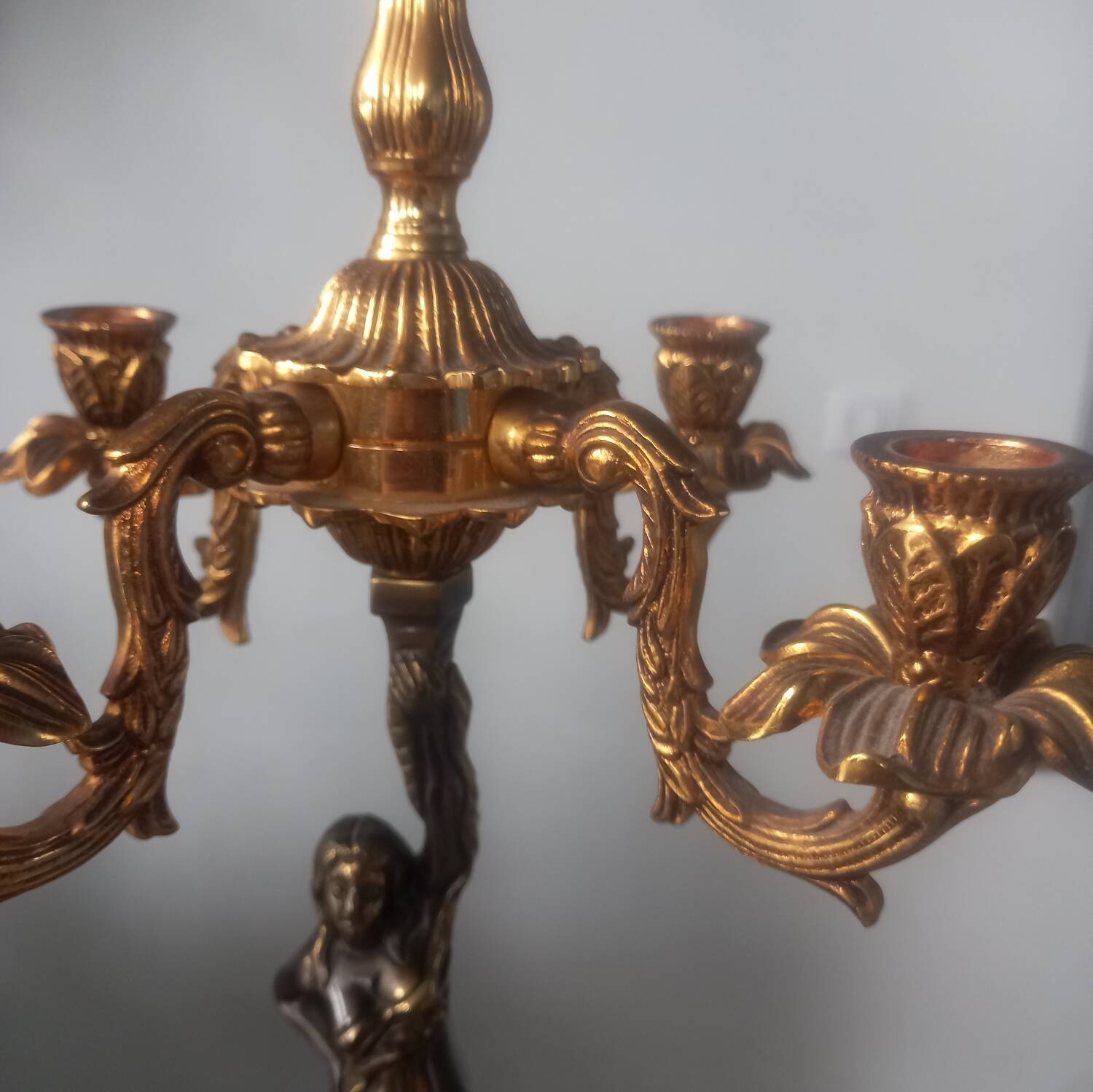 Pair of gilded bronze candlesticks with nude women