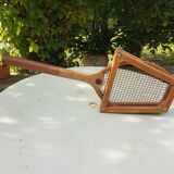 Old wooden tennis racket with frame