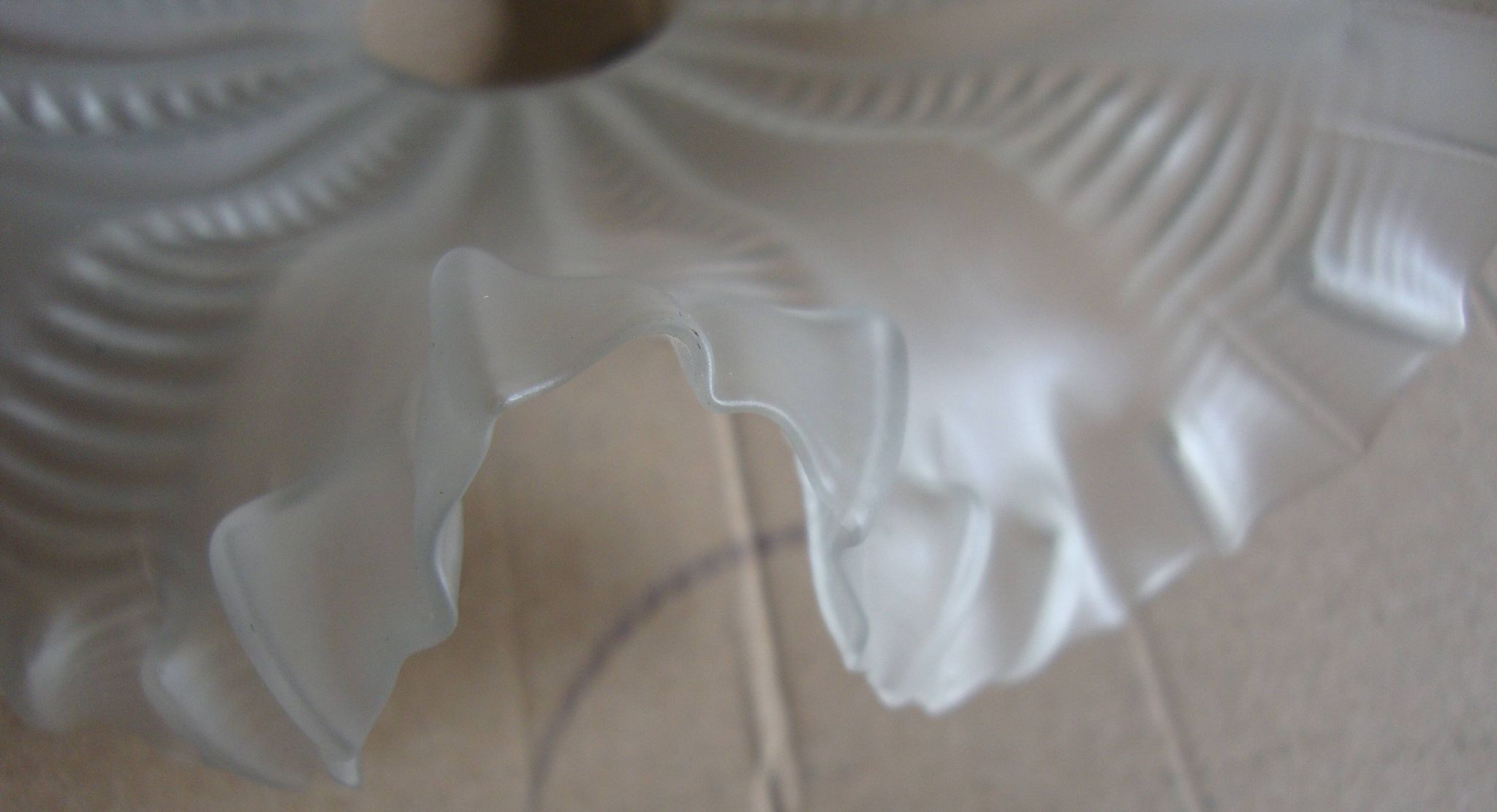 Vintage pleated glass lampshade with claw and socket.