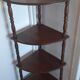 Corner shelf on wooden legs