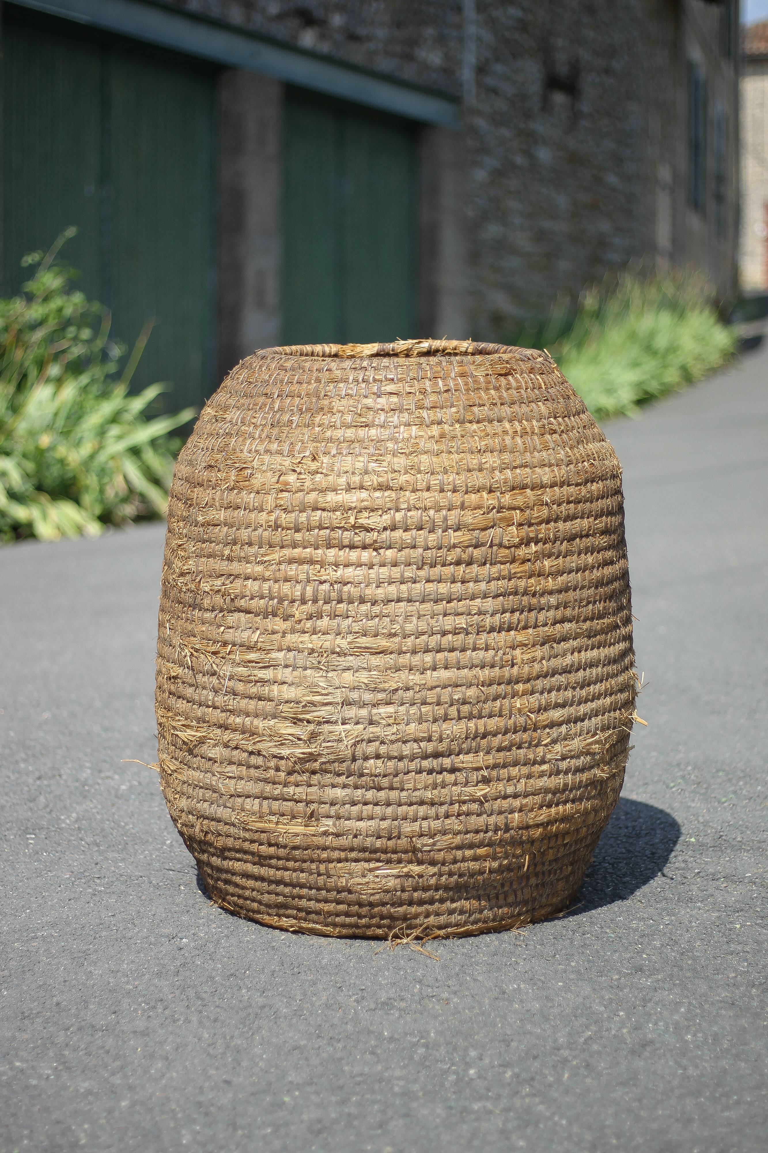 Very large old basket, burgundy straw and bramble, woven basket