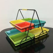 Black metal appetizer set with colorful ceramic ramekins