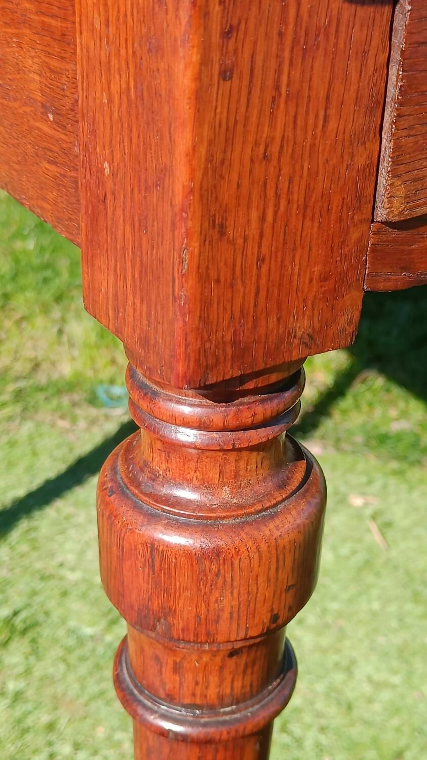 Antique solid wood table with a through drawer.