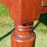 Antique solid wood table with a through drawer.