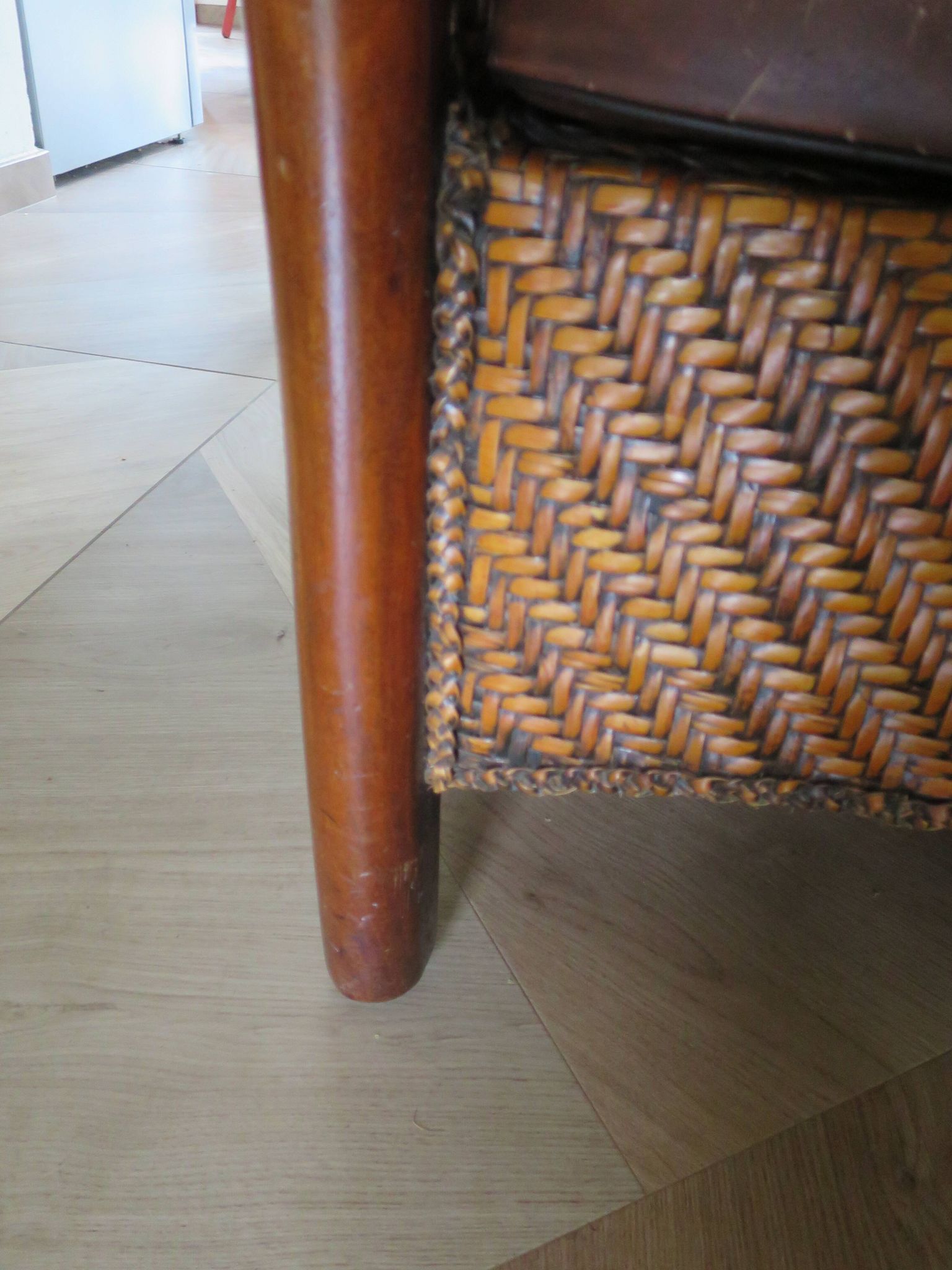 Woven rattan armchair and exotic wood in colonial style, 1980s.