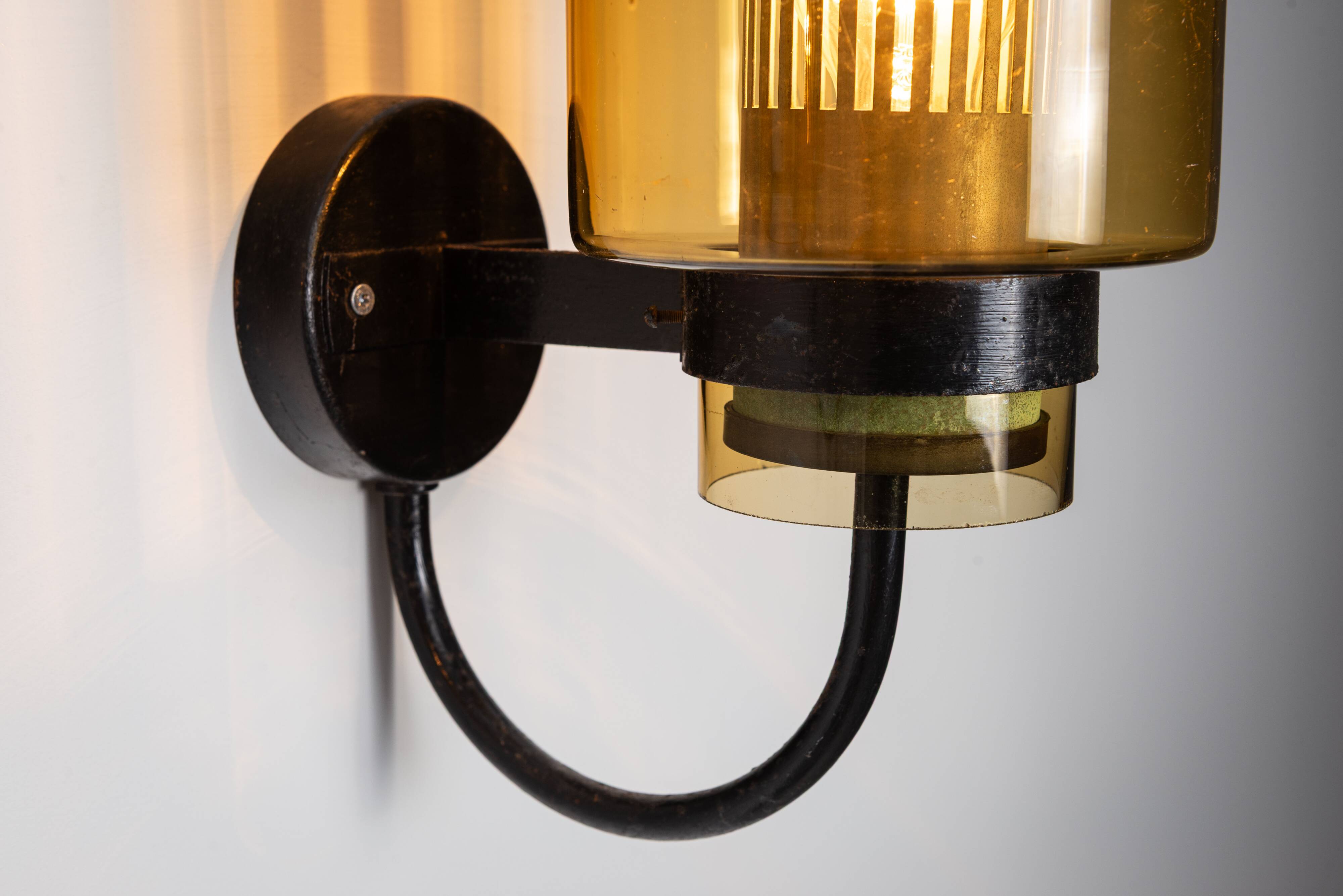 Pair of black metal wall lamps with yellow shades and inner diffuser