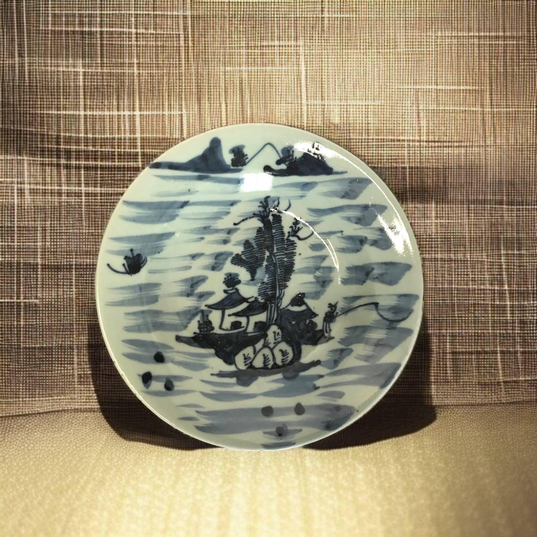 Asia, celadon porcelain plate with fisherman decor, late 19th century