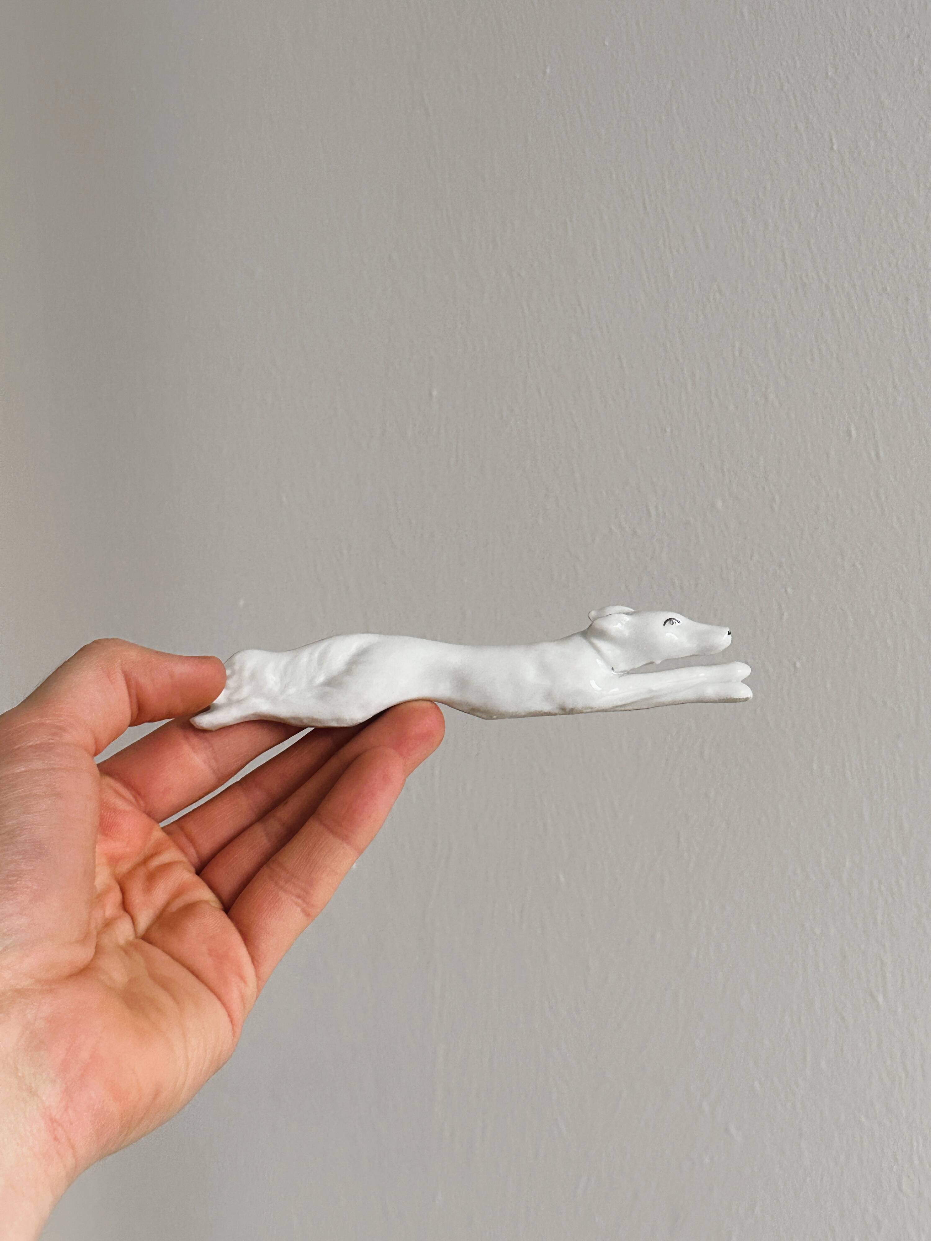 Porcelain animal knife holder.