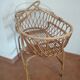 Rattan cradle with its support