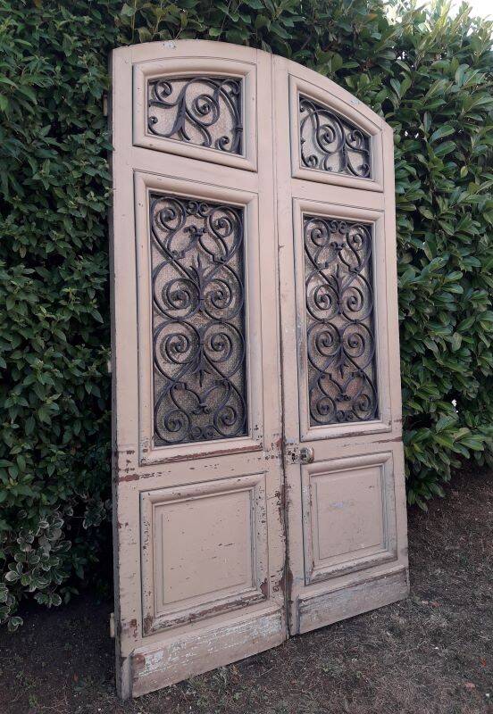 19th century double arched entrance door in oak with grilles and old glass