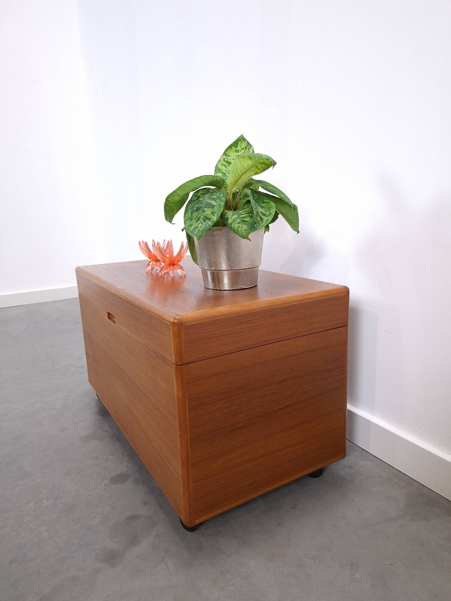 Vintage teak Danish chest with a lid on wheels, toy chest.