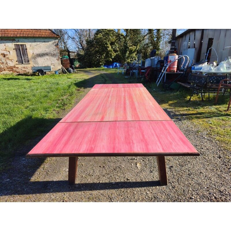 1960s oak dining table with integrated extensions.
