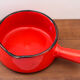 Vintage poelon in bright red glazed ceramic