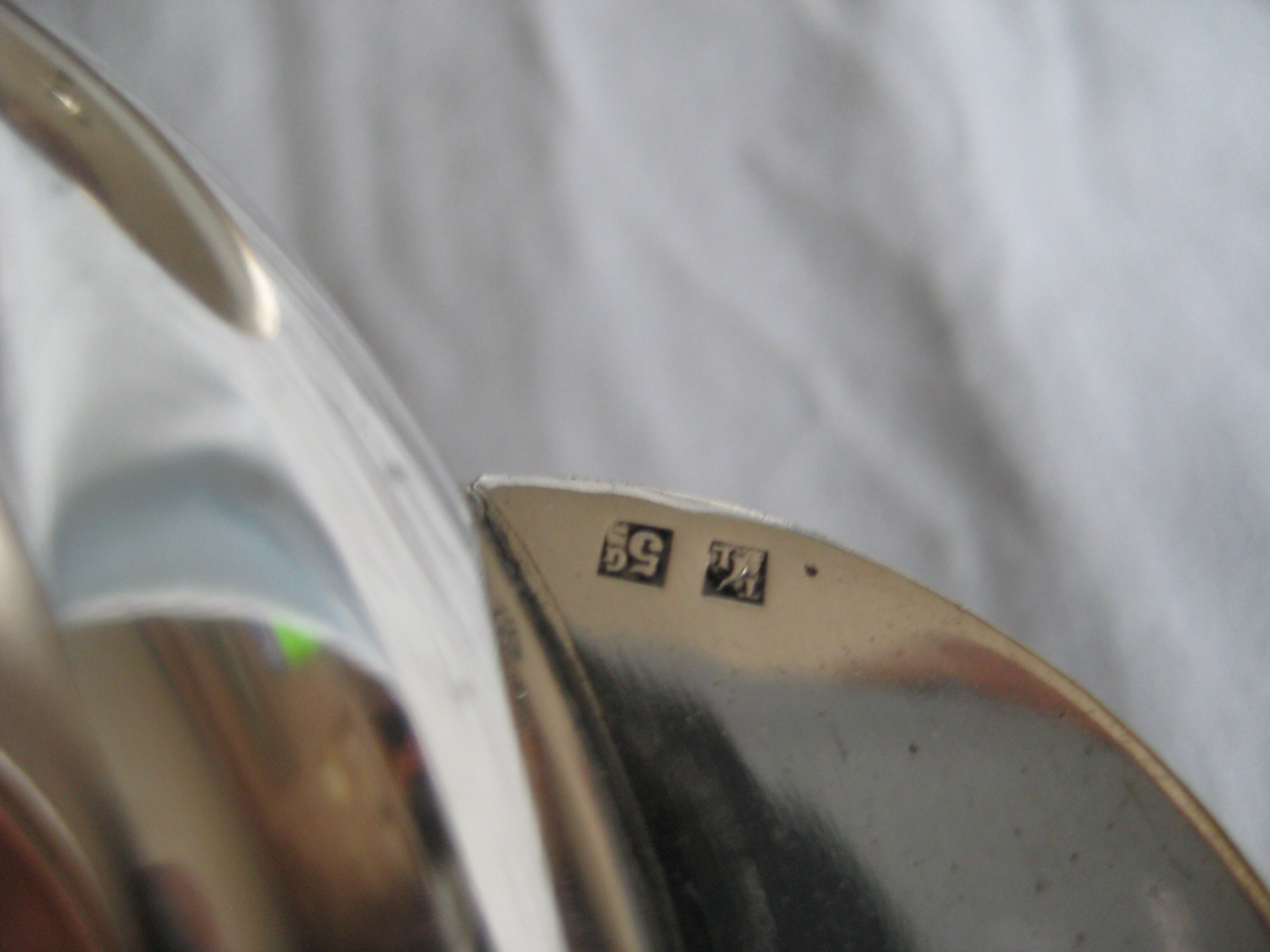 silver metal sugar and silver sugar spoon.