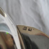 silver metal sugar and silver sugar spoon.