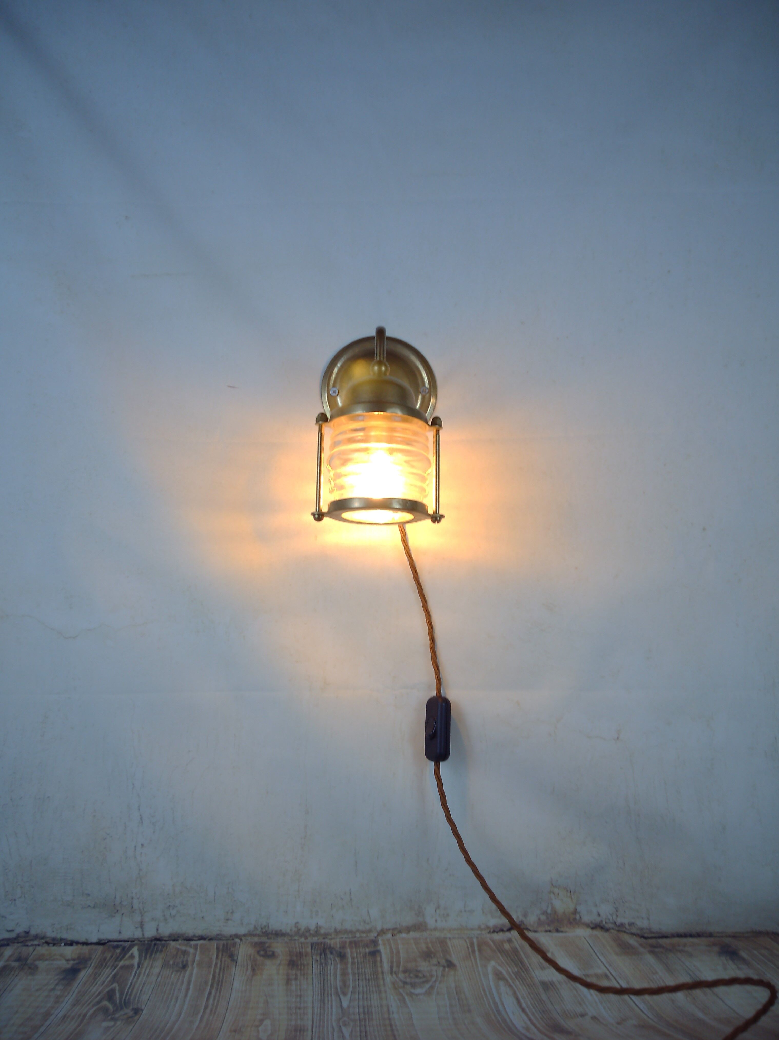 Vintage wallmounted brass lamp from a ship.