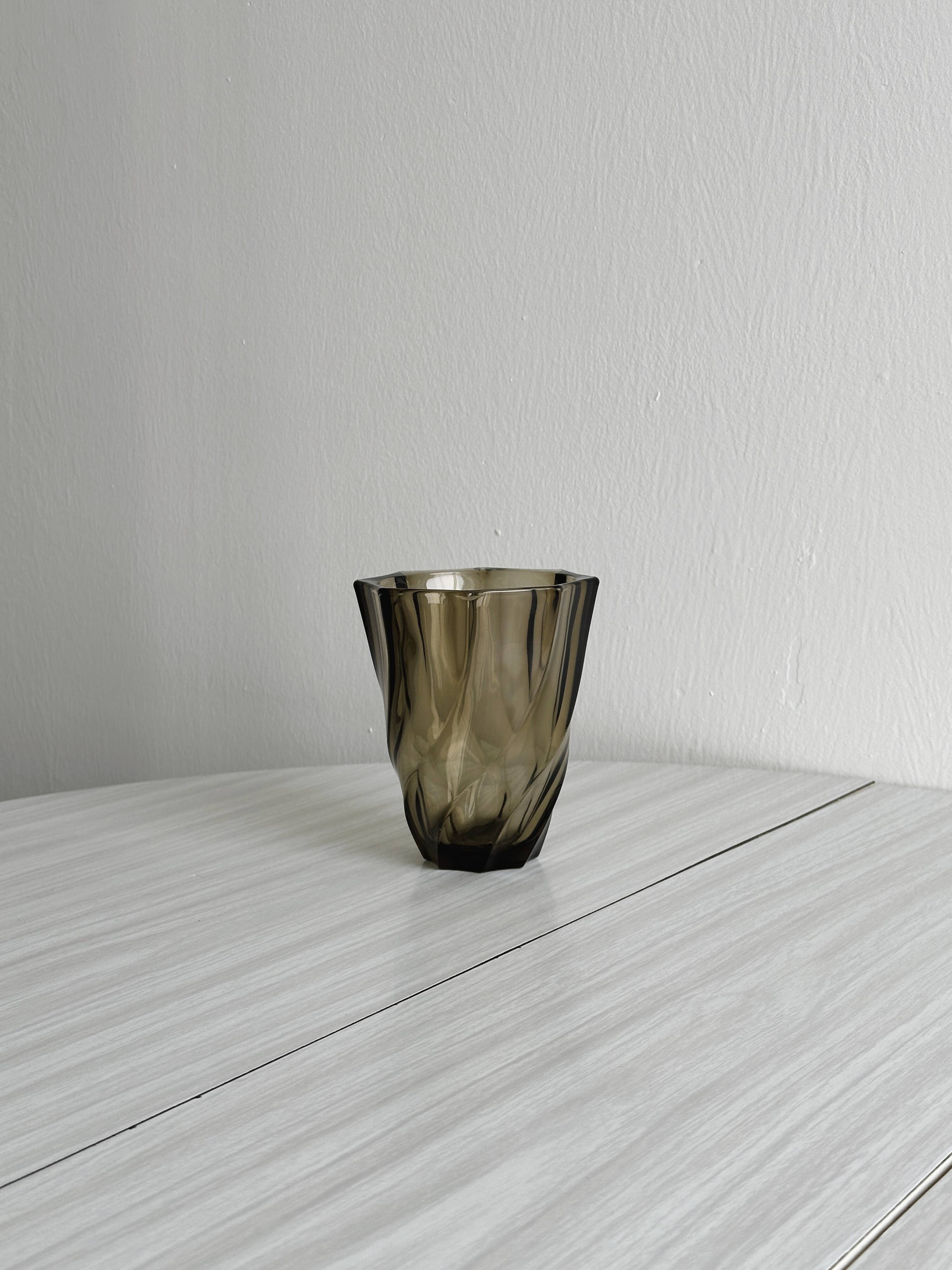 Smoked glass vase with twisted design