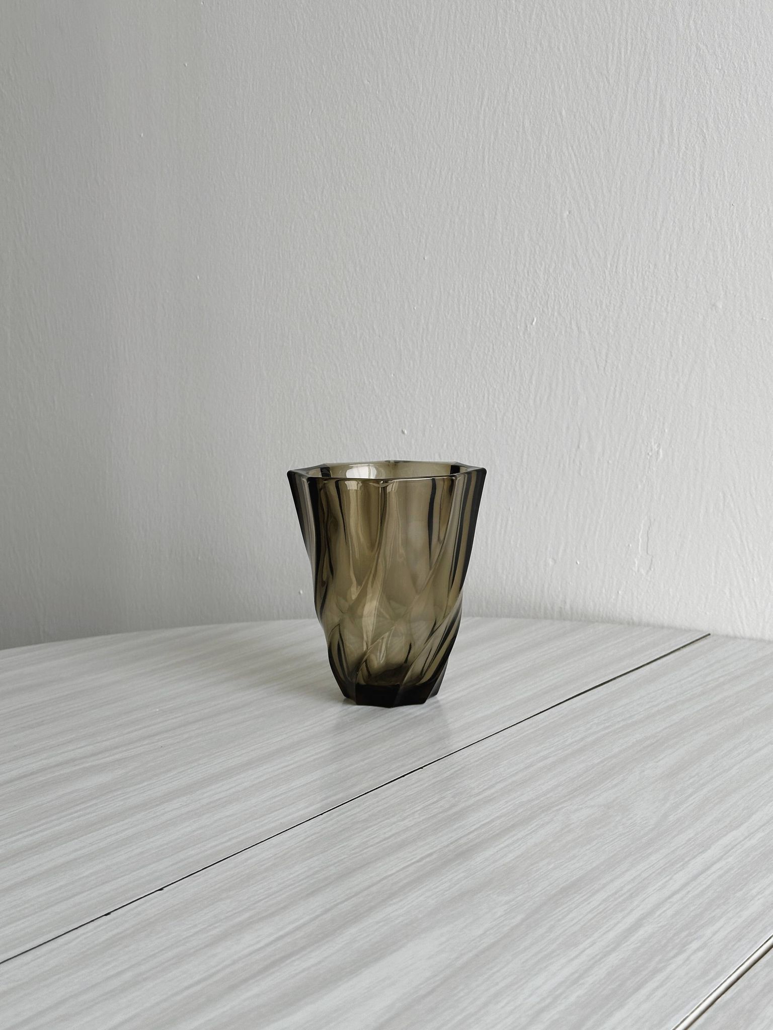 Smoked glass vase with twisted design