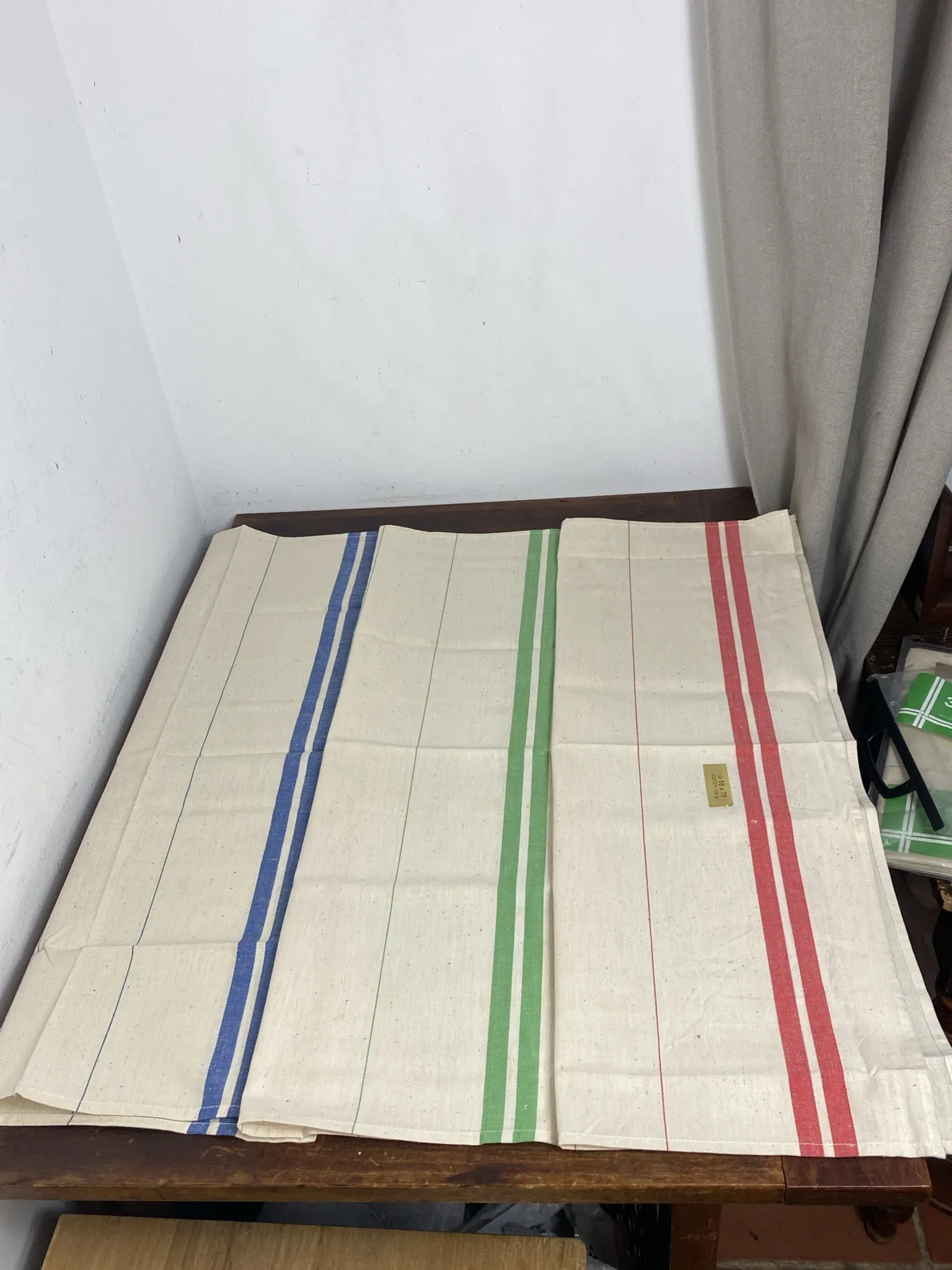 Three new multicoloured tea towels made of Cholet fabric, 100% cotton.