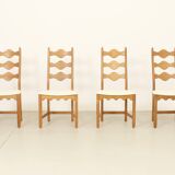 Four oak dining chairs by Henning Kjaernulf.