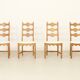 Four oak dining chairs by Henning Kjaernulf.