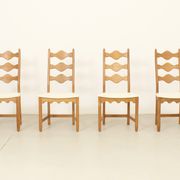 Four oak dining chairs by Henning Kjaernulf.