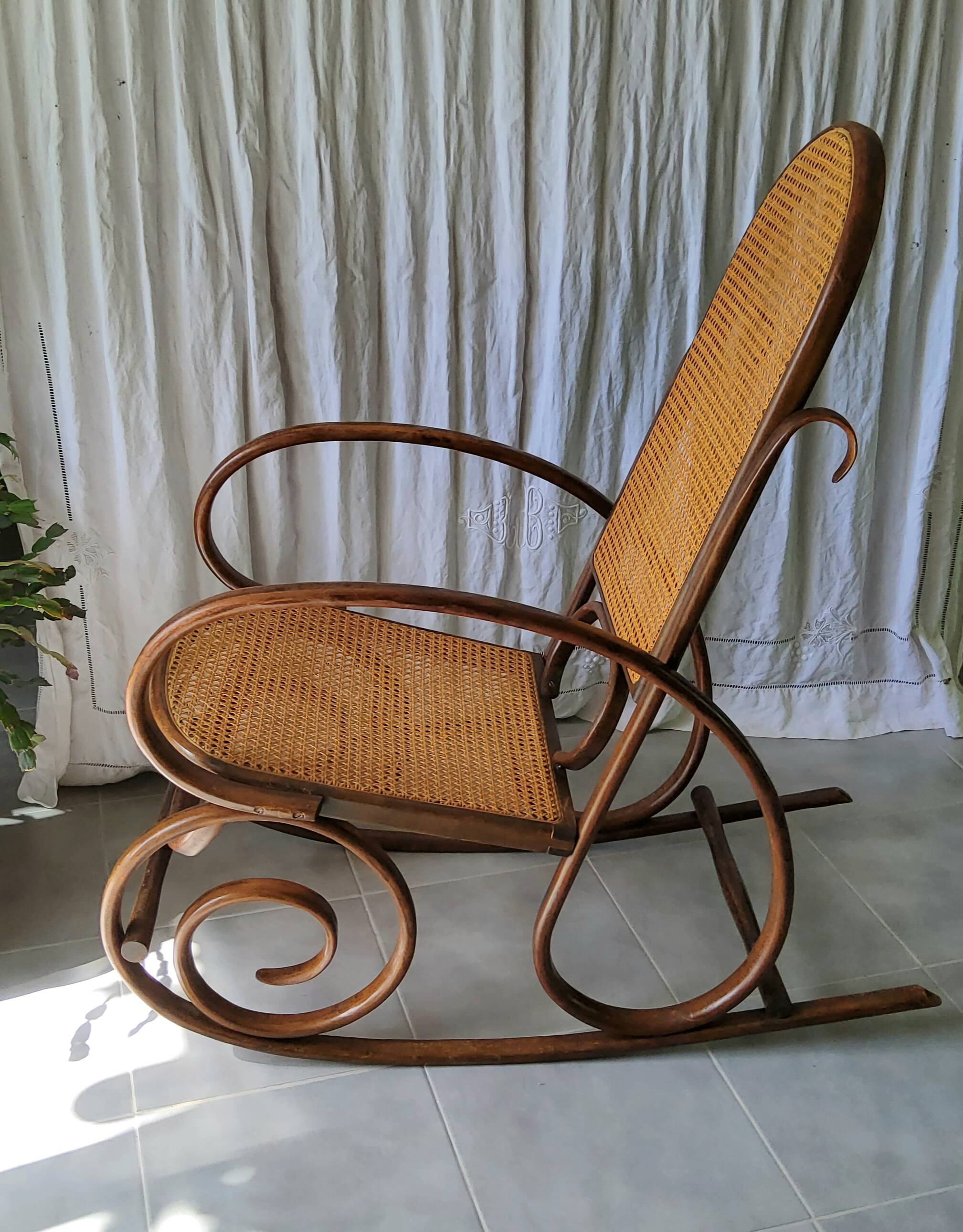 Antique caned rocking chair